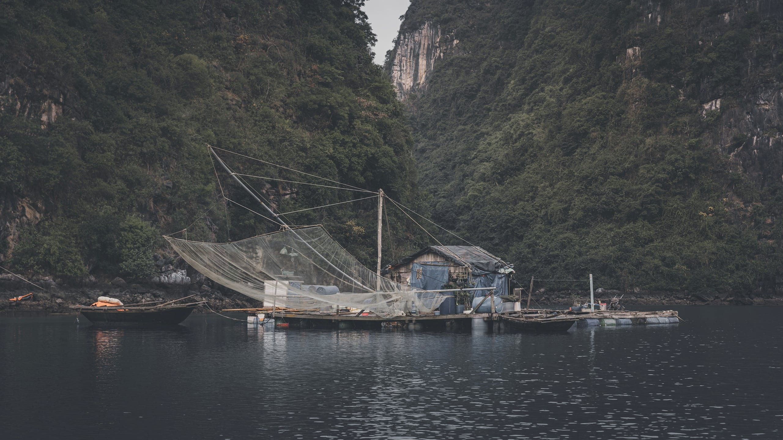 A fisherman's net, strung across a quiet cove